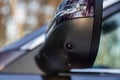 surround cam monitor system system in a modern car.. side view rearview mirror of modern car with round view camera Royalty Free Stock Photo