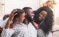 Black man spending time with wife and daughter at home Royalty Free Stock Photo