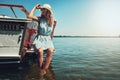 Surrounded by nothing but the sea. an attractive young woman spending the day on her private yacht.