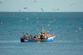 Fisherman inspecting their catch at sea