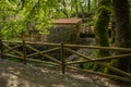 Old mill on the bank of the river Lourido in the park of the fountain of Stanislaus