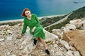 Surroundings of Antalya in spring, view of Mediterranean Sea from observation deck. Young woman in green evening dress Royalty Free Stock Photo