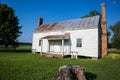 SURRY, VIRGINIA/USA - JULY 20, 2019: The last remaining slave cabin circa 1830 which was built at Bacon`s Castle, the site of a fo Royalty Free Stock Photo