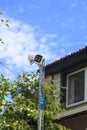 Surveillance and safety home concept. Security CCTV camera monitoring perimeter of private house  in village Royalty Free Stock Photo