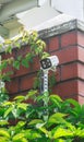 Surveillance and safety home concept. Security CCTV camera monitoring perimeter of private house  in village Royalty Free Stock Photo