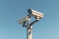 Surveillance Security Camera Mounted on Pole Under Clear Blue Sky Royalty Free Stock Photo