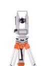 Survey equipment theodolite on a tripod. Isolated on white