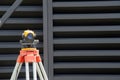 Surveying measuring equipment level transit on tripod at construction building area site Royalty Free Stock Photo