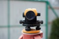 Surveying measuring equipment level transit on tripod at construction building area site Royalty Free Stock Photo