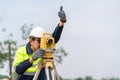 Surveyor Civil Engineer thumbs up with equipment on the construction site