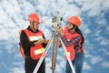 Surveyor or Engineer making measure with partner on a field. Royalty Free Stock Photo