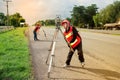 Surveyor or Engineer making measure with partner on the field. Royalty Free Stock Photo