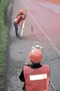 Surveyor or Engineer making measure with partner on the highway. Royalty Free Stock Photo