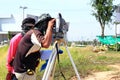 Surveyor engineer making measuring Royalty Free Stock Photo