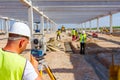 Civil engineer, geodesist is working with total station on a building site Royalty Free Stock Photo