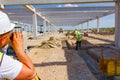 Civil engineer, geodesist is working with total station on a building site Royalty Free Stock Photo