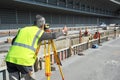 Surveyor engineer worker making measuring with theodolite instrument equipment Royalty Free Stock Photo