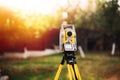 Surveyor engineering equipment with theodolite and total station in a garden Royalty Free Stock Photo