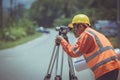 Surveyor engineers work on road construction site