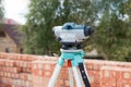 Surveyor equipment optical level or theodolite outdoors at construction site Royalty Free Stock Photo