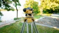 Surveyor equipment theodolite on the construction site. Land surveying with optical measurement tools. Royalty Free Stock Photo