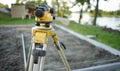 Surveyor equipment theodolite on the construction site. Land surveying with optical measurement tools. Royalty Free Stock Photo