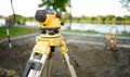 Surveyor equipment theodolite on the construction site. Land surveying with optical measurement tools. Royalty Free Stock Photo