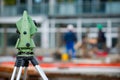 Surveyor equipment theodolite on tripod at building area Royalty Free Stock Photo