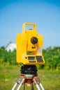 Surveyor equipment theodolite on tripod on future construction site Royalty Free Stock Photo