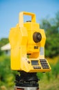 Surveyor equipment theodolite on tripod on future construction site Royalty Free Stock Photo