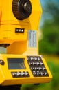 Surveyor equipment theodolite on tripod on future construction site Royalty Free Stock Photo