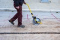 Surveyor with measuring wheel (odometer) Royalty Free Stock Photo