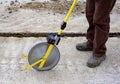 Surveyor with measuring wheel odometer Royalty Free Stock Photo