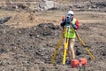 The surveyor is shooting at a building site Royalty Free Stock Photo