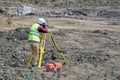 The surveyor is shooting at a building site Royalty Free Stock Photo