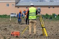 The surveyor is shooting at a building site