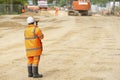 Surveyor site engineers working with electronic theodolite and GPS on road construction site Royalty Free Stock Photo