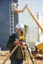 Surveyor worker with theodolite Royalty Free Stock Photo