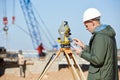 Surveyor worker with theodolite Royalty Free Stock Photo