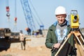 Surveyor worker with theodolite Royalty Free Stock Photo