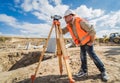 Surveyor worker with theodolite equipment at construction site Royalty Free Stock Photo