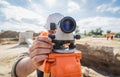 Surveyor worker with theodolite equipment at construction site Royalty Free Stock Photo