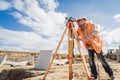 Surveyor worker with theodolite equipment at construction site Royalty Free Stock Photo