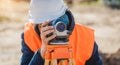 Surveyor worker with theodolite equipment at construction site Royalty Free Stock Photo