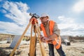 Surveyor worker with theodolite equipment at construction site Royalty Free Stock Photo