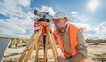 Surveyor worker with theodolite equipment at construction site Royalty Free Stock Photo