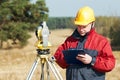 Surveyor worker with theodolite Royalty Free Stock Photo