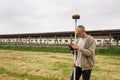 A surveyor works with a GNSS receiver Royalty Free Stock Photo