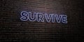 SURVIVE -Realistic Neon Sign on Brick Wall background - 3D rendered royalty free stock image