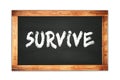 SURVIVE text written on wooden frame school blackboard Royalty Free Stock Photo